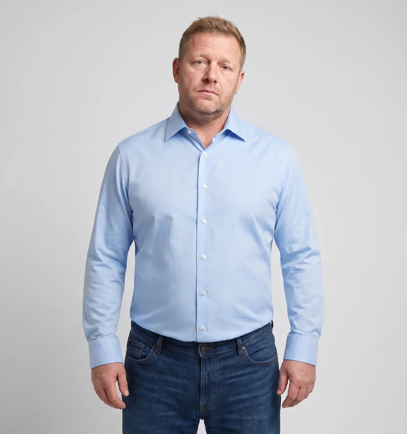 Man in a fitted blue shirt